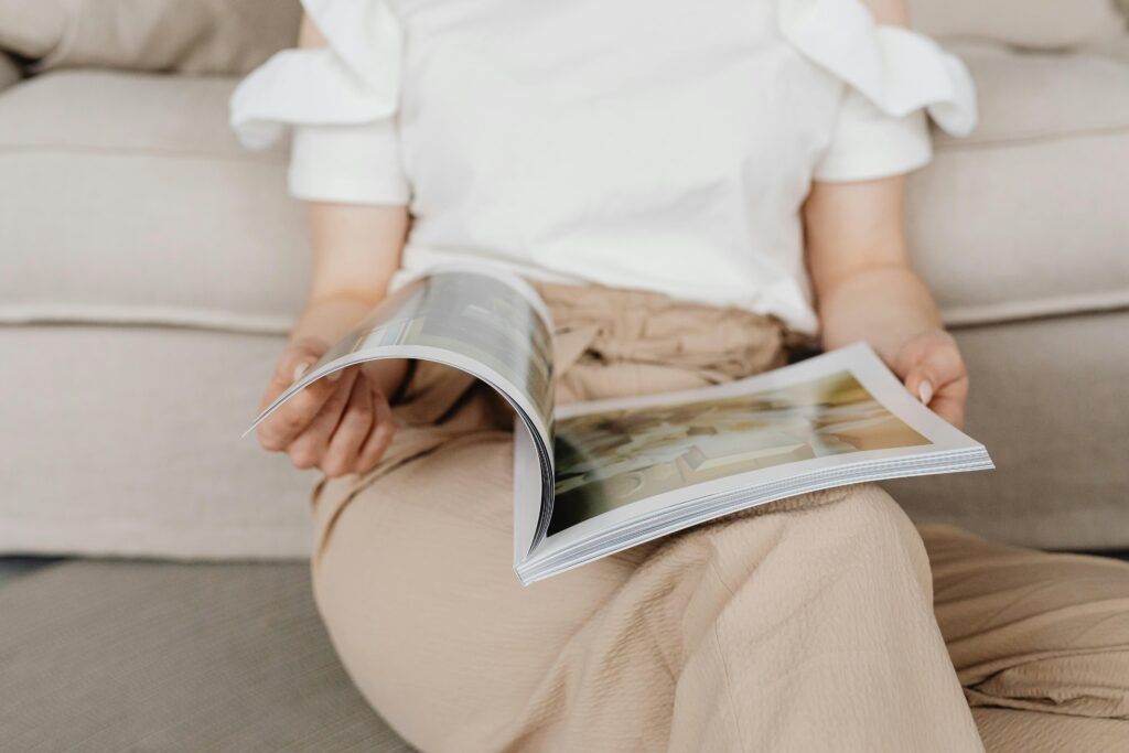 A Person Flipping the Pages of a Magazine